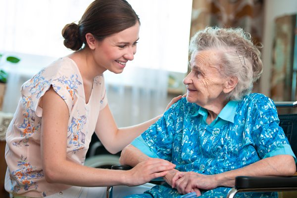 Domiciliary care worker with client